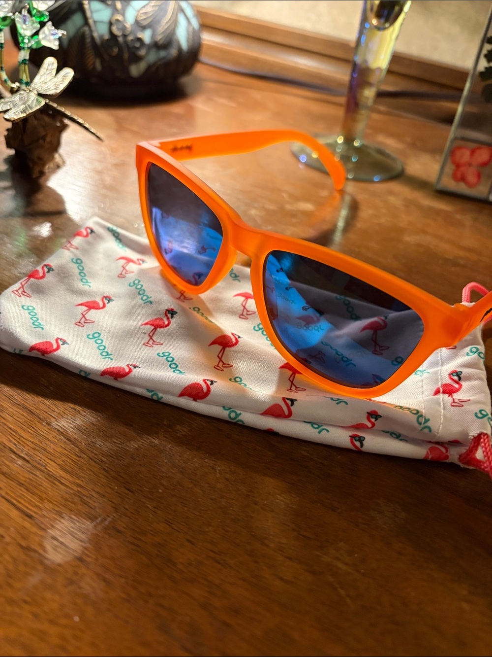 Vibrant Orange Goodr Sunglasses with Blue Mirrored Lenses